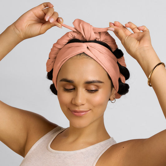 KITSCH Set & Flow Active Headband in Terracotta — model wearing terracotta set & flow headband as a sleep style — wakes up to defined, frizz-free hair in the morning