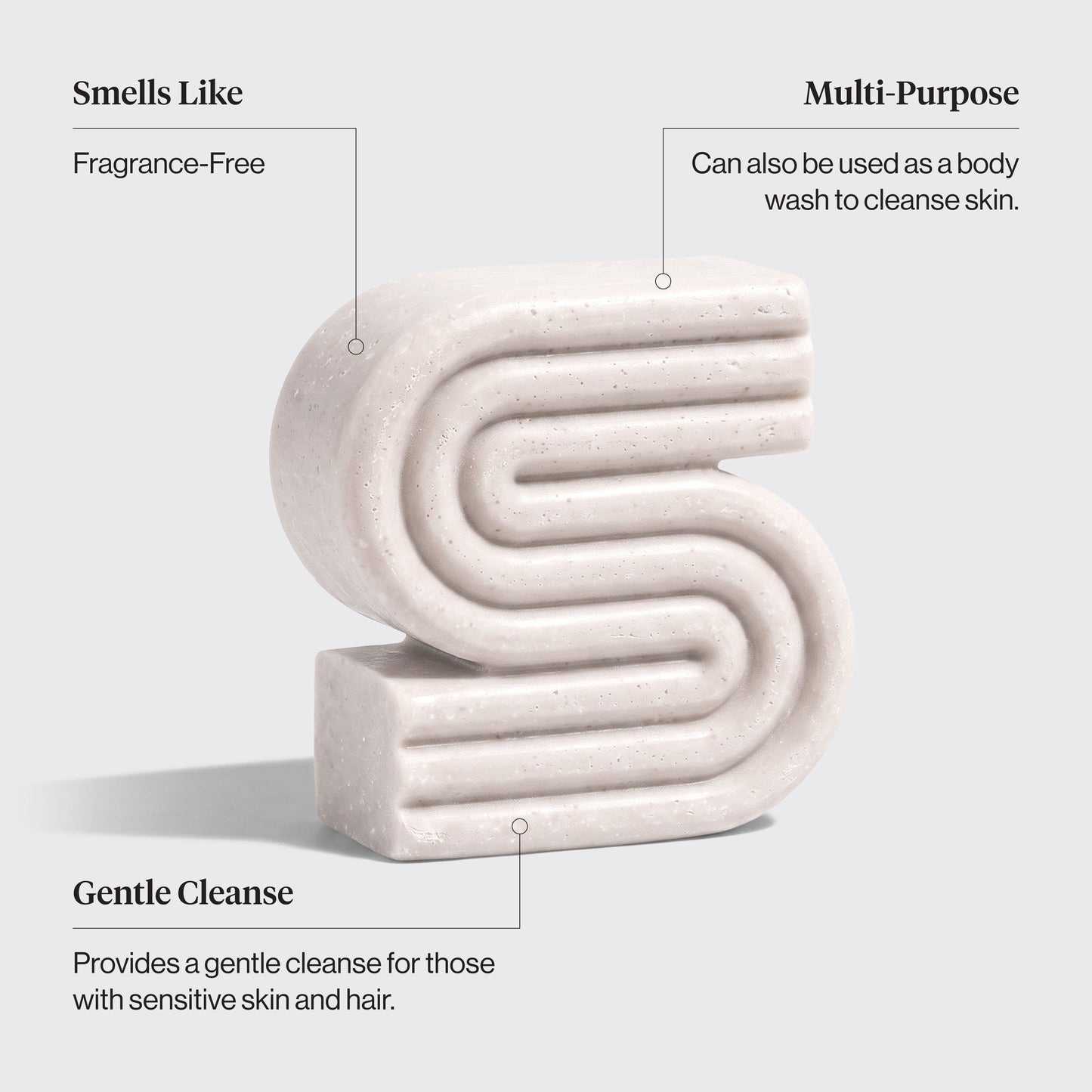 White kitsch ultra sensitive shampoo and body wash bar with text describing its features on a light gray background. Features include: smells like - fragrance free, multi-purpose - can be used as a body wash to cleanse skin, and gentle cleanse - provides a gentle cleanse for those with sensitive skin and hair