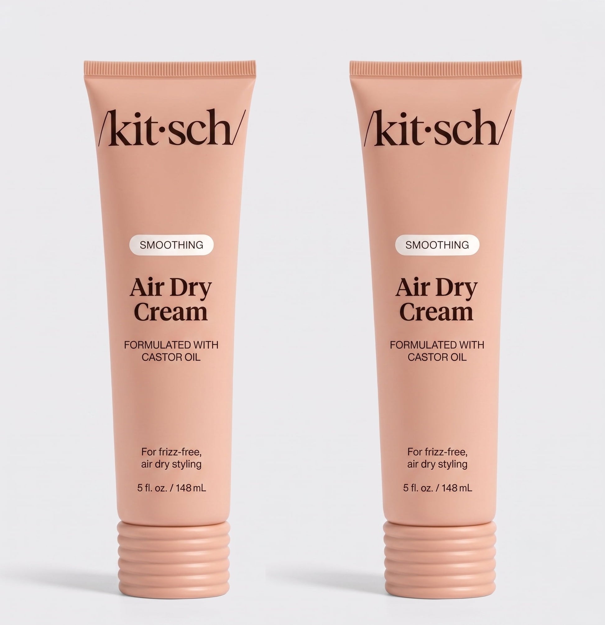 Two tubes of Kitsch Smoothing Air Dry Cream formulated with castor oil, 5 fl. oz. (148 mL), displayed side by side on a white background for frizz-free, air-dry styling.